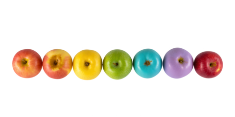 Colorful oval shaped fruit arranged in a rainbow spectrum against a stark black background