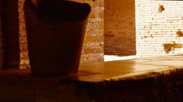 The thermopolium or hot food bar in Ostia Antica, the old port of Rome, Lazio, Italy, dating back to the 7th century BC