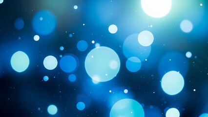 Abstract blue bokeh lights and particles on a dark background