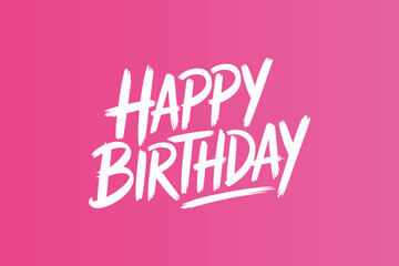 Handwritten brush script text saying happy birthday on pink