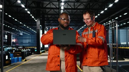 Technicians team managing assembly workflow with equipment, standing near steel machinery and fabrication stations for industrial development. Structured manufacturing process. Camera A. - Powered by Adobe