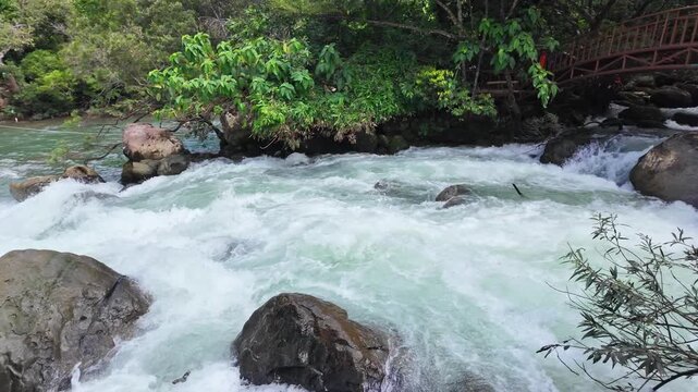 Superb view of summer: Slow motion of the fantastic Moot valley in Phong Nha National Park, Vietnam with the sound of a clear stream flowing through the peaceful tropical jungle