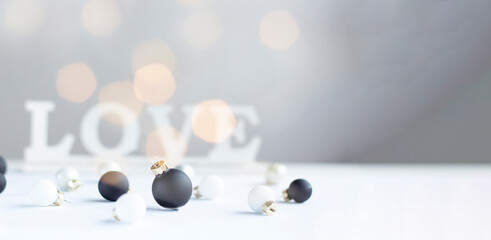 Minimalist Christmas Baubles with LOVE Sign and Soft Bokeh Lights