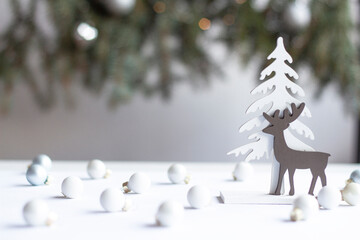 Minimalist Winter Scene with Wooden Reindeer and Christmas Baubles
