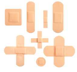photograph of an assortment of beige adhesive bandages and medical plasters in various shapes arranged symmetrically, isolated on a transparent background.