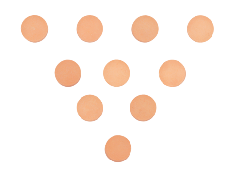 detailed photograph of ten small, round, peach-colored medicinal pills or tablets arranged geometrically in a pyramid shape, isolated on black.