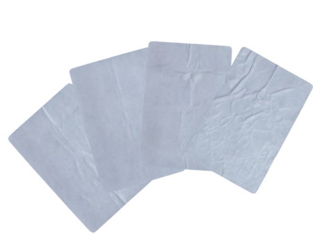 overlapping isolated white square papers or adhesive labels with rounded corners, displaying a heavily wrinkled and creased texture against black. - Powered by Adobe