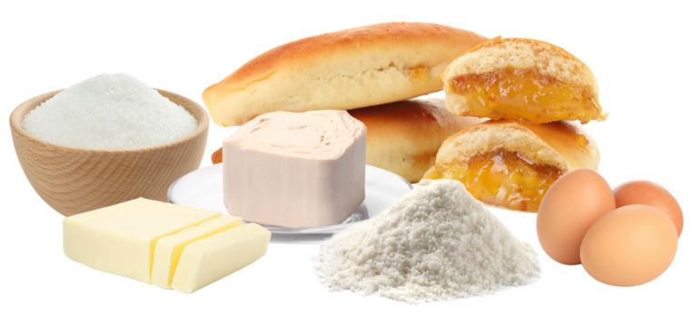 collection of raw baking ingredients like sugar, yeast, flour, butter, and eggs, displayed next to freshly baked sweet buns or pastries, isolated on black.