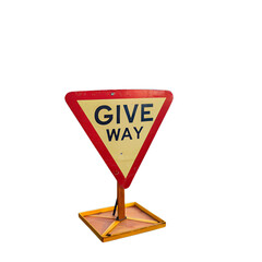 A close up of a give way sign with a red border on a black background outdoors