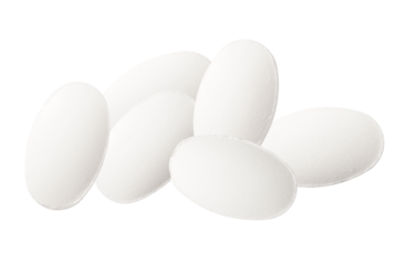 cluster of smooth white oval shaped medicine pills piled together on a stark transparent background, representing dietary supplements, vitamins, wellness, and essential health maintenance.
