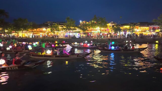 Timelapse of Nightscape of Thu Bon River and vintage buildings in Hoi An old town, Vietnam UNESCO World Heritage Site