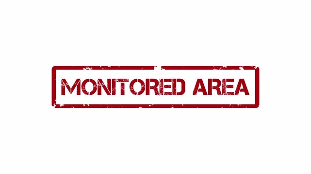 Monitored area red stamp indicating surveillance and security protocols in place
