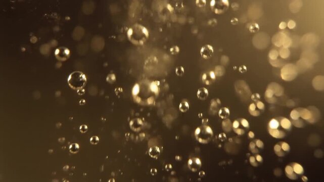 Close up sparkling champagne bubbles rising in golden light, macro aesthetic, elegant and luxurious, warm festive tones