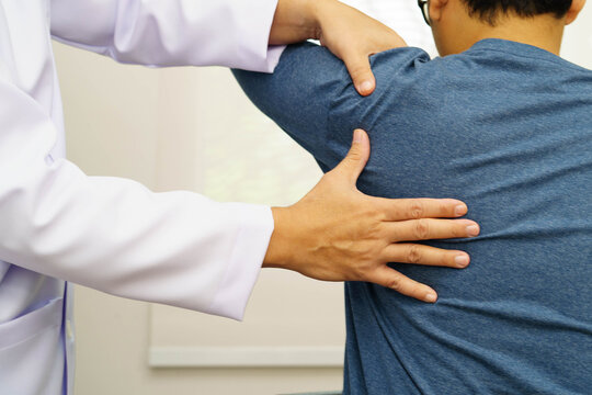 Physical therapy, Asian therapist doctor treat perform pain therapy in hospital.