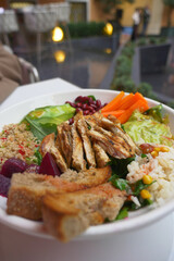 Delicious grilled chicken salad bowl from a local cafe