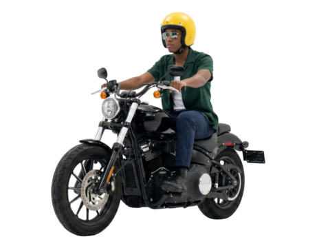 Rider on a classic motorcycle wearing a yellow helmet against transparent backdrop