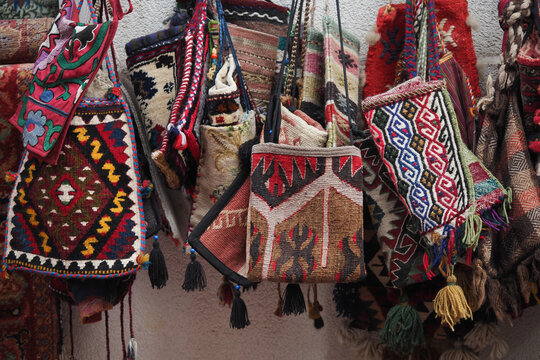 Colorful handmade bags displayed at a local market