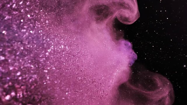 Slow motion movement of vibrant pink and purple cosmic dust particles flowing smoothly across a deep black background modern design, flowing smoothly, smooth motion