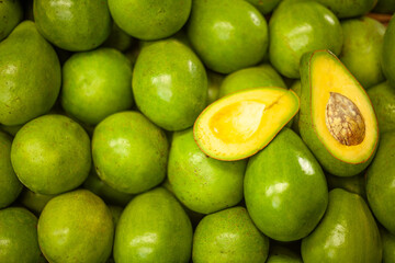 Fresh avocados in top-down view