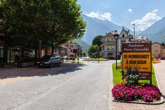 Martigny, Valais, Switzerland - August 10th, 2025: Place de Plaisance in a Swiss valley with the Alps mountains in the background.