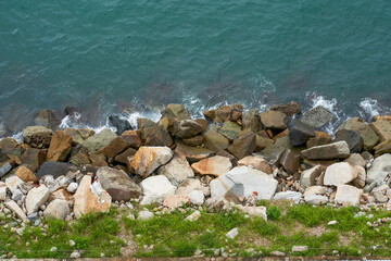 Breakwater stones along the seaside park trail in Hong Kong, China