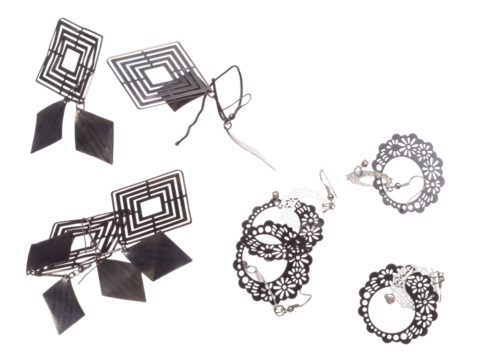 Fashion Silver Earrings with beautiful work detail is value. Luxury Silver diamond earring is fashion trend and fly in air. White background isolated