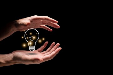 Inspiration with light bulb concept on black background. A light bulb held by hands. Illuminated bulb represents of new idea, solution, and creativity 