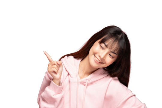 Asian young woman smiling and pointing finger wearing pink hoodie, casual portrait with playful expression and long dark hair