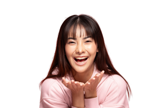 Asian young woman smiling with hands cupped under chin wearing pink sweatshirt expressing joyful excitement