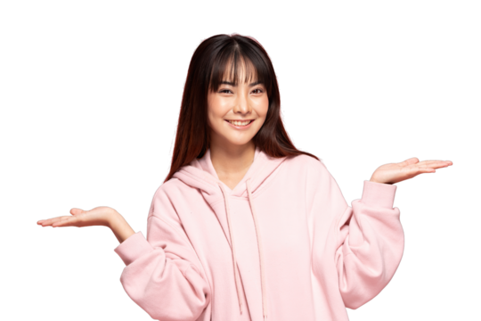 Asian Smiling young woman in pink hoodie holding palms up in welcoming gesture, cheerful expression and casual style, studio portrait conveying friendliness and confidence