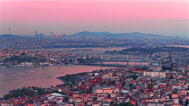 Blue Horn Grand Bazar Istanbul Turkey T&uuml;rkiye aerial drone sunset pink sky afterglow cityscape buildings panoramic landscape mosque skyscrapers Bosphorus Strait ferry boats harbor view pan left motion
