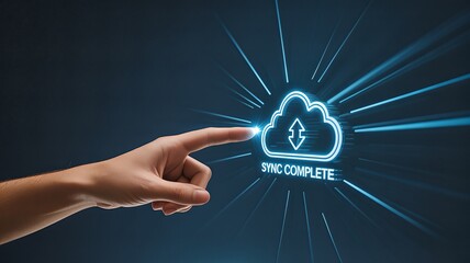 A human finger points to a glowing blue cloud icon with the text 'SYNC COMPLETE' indicating the successful completion of a data synchronization process.