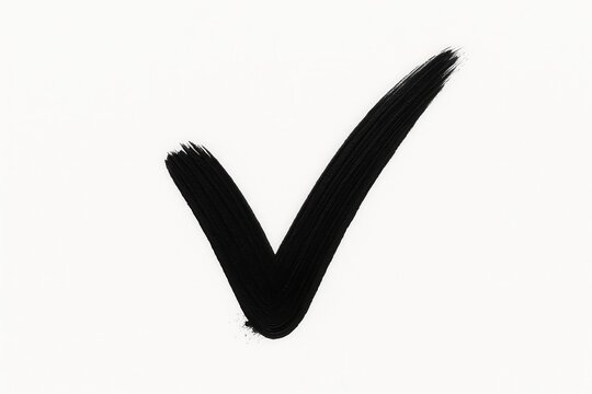 Bold black ink brush stroke shaped like wide check mark with subtle splatter on clean white background