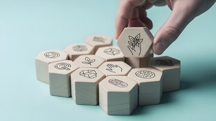 Hand placing coffin shaped wooden block with halloween design on stack