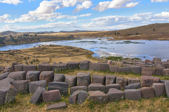 Panoramic view of a stone path and Lake Umayo, a beautiful landscape.
