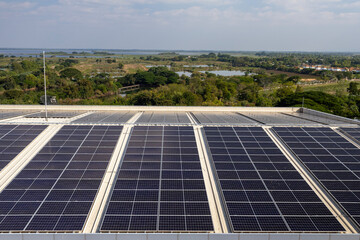High-quality photo of solar panels mounted on a contemporary building rooftop, showcasing clean energy technology and sustainable urban infrastructure.