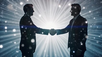 Silhouetted business people shaking hands with a bright light background.