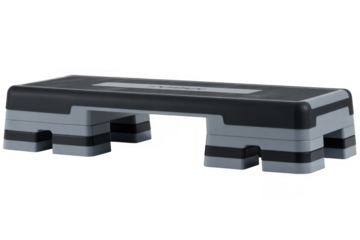 Black and gray aerobic step platform with textured surface and adjustable height isolated on a transparent background
