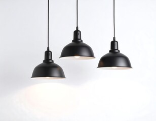 Obraz premium Three modern black pendant lights, each with a rounded shade, hanging against a plain white background, highlighting the sleek design