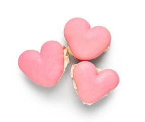 Sweet heart-shaped macaroons on white background. Valentine's Day celebration