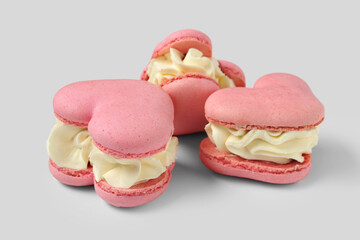 Sweet heart-shaped macaroons on white background. Valentine's Day celebration