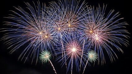 Brilliant multicolored fireworks light up the evening sky, creating a festive and celebratory atmosphere with dazzling bursts
