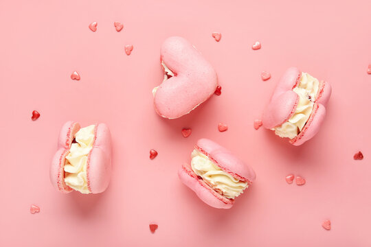 Sweet heart-shaped macaroons on pink background. Valentine's Day celebration - Powered by Adobe