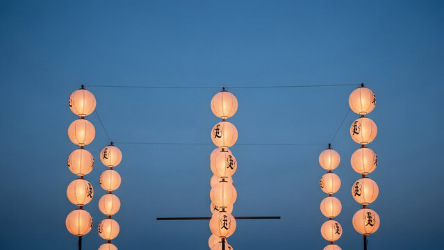 A serene display of glowing paper lanterns celebrating a traditional chinese lantern festival under a twilight sky