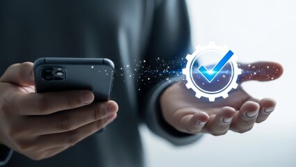 Person holding a smartphone with a digital checkmark and gear icon floating above their hand