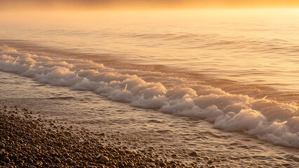 Gentle Morning Waves with Mist and Soft Golden Hour Light