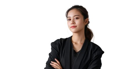 Poised Confidence: A young asian woman exudes confidence and poise, her arms crossed, her gaze direct, showcasing a captivating presence.