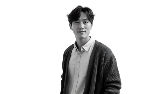 Black and White Studio Portrait: A composed and self-assured man in a studio portrait, his gaze directed forward as he stands confidently. 