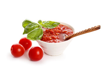 Bowl with tasty tomato sauce isolated on white background, closeup
