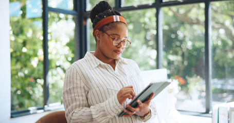 Freelancer, tablet and stylus with black woman in home office for web designer, research and...